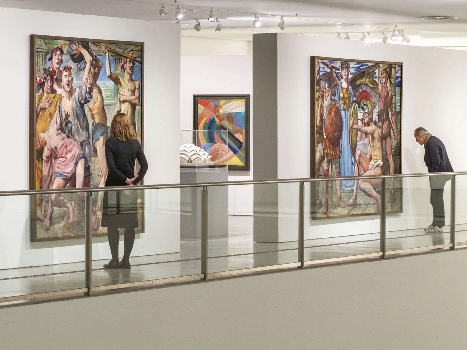 Berlinische Galerie exhibition showcasing vibrant, large-scale figurative paintings and modern art, with visitors admiring the works from a multi-level gallery space.